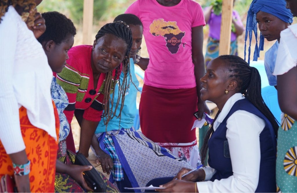 Image shows women at Ambokili Farm recieving training from one of the local banks on financial literacy and access to financial services. This is a women project aimed at eradicating poverty through women.